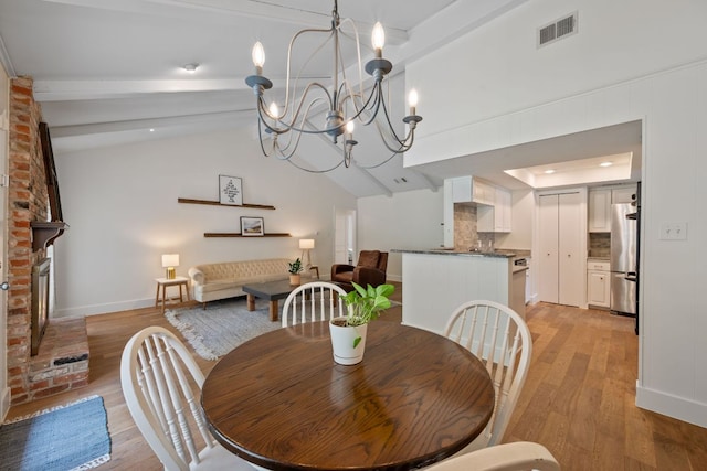 1314 Quailfield Cir, Austin, TX 78758 - dining room featuring light wood-style flooring and a chandelier