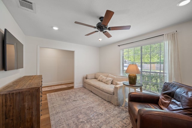 1314 Quailfield Cir, Austin, TX 78758 - living area with wood finished floors, a ceiling fan, and recessed lighting