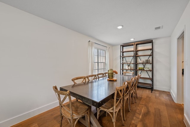 1314 Quailfield Cir, Austin, TX 78758 - dining room with wood finished floors and recessed lighting