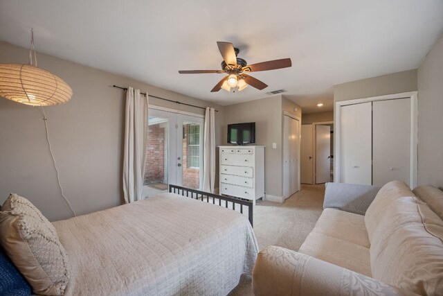 1314 Quailfield Cir, Austin, TX 78758 - bedroom featuring two closets, light carpet, ceiling fan, and access to outside
