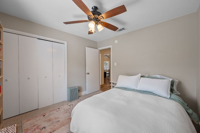 1314 Quailfield Cir, Austin, TX 78758 - bedroom featuring a closet, a ceiling fan, and light carpet