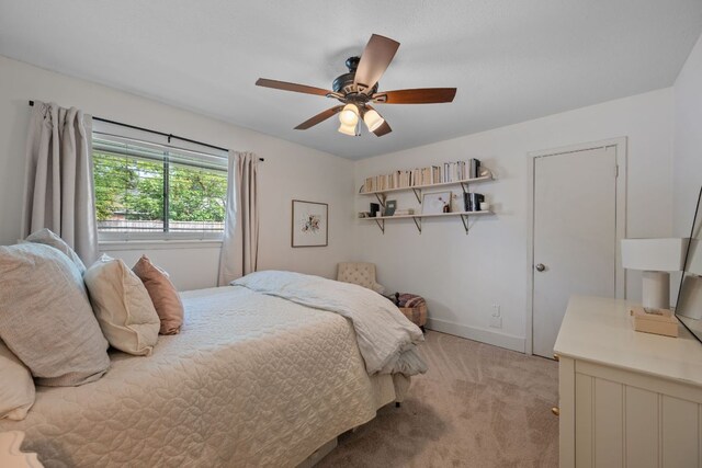 1314 Quailfield Cir, Austin, TX 78758 - bedroom featuring light carpet and a ceiling fan