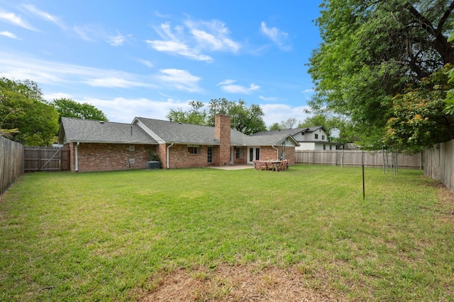 1314 Quailfield Cir, Austin, TX 78758 - rear view of property with brick siding, a chimney, a fenced backyard, and a patio