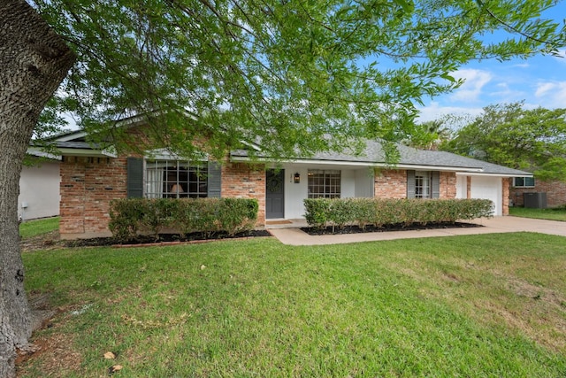 1314 Quailfield Cir, Austin, TX 78758 - ranch-style home featuring a garage, a front lawn, driveway, and brick siding