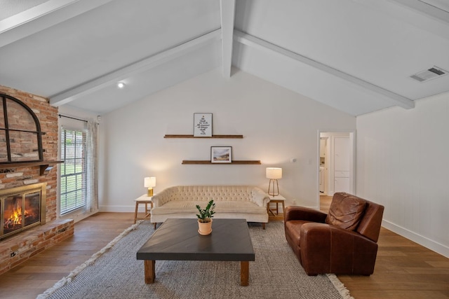 1314 Quailfield Cir, Austin, TX 78758 - living room featuring wood finished floors and a fireplace