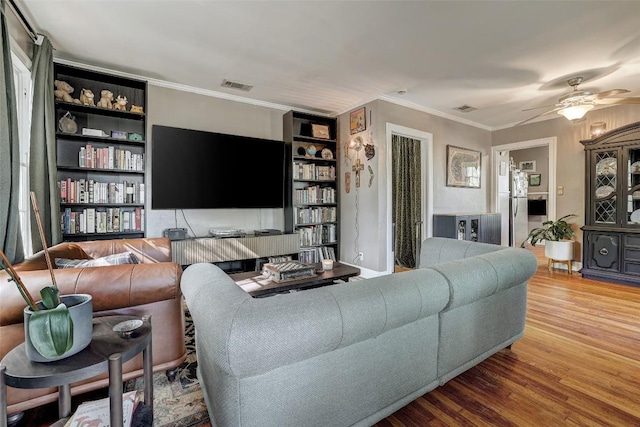 809 E 44th St, Austin, TX 78751 - living area with wood finished floors, crown molding, and a ceiling fan
