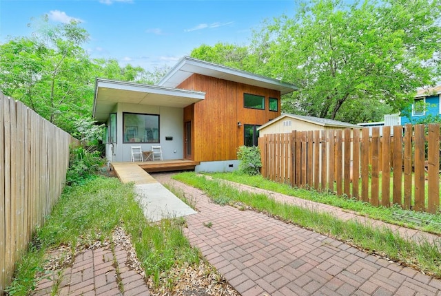 809 E 44th St, Austin, TX 78751 - contemporary house featuring a fenced backyard and covered porch