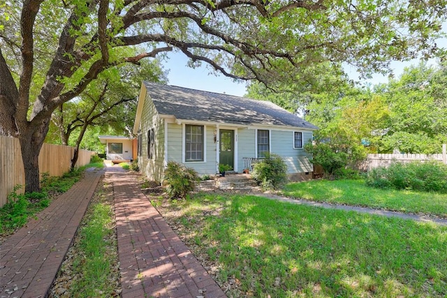 809 E 44th St, Austin, TX 78751 - view of front of house featuring roof with shingles