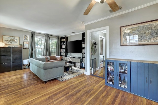 809 E 44th St, Austin, TX 78751 - living room with ceiling fan, wood finished floors, and crown molding