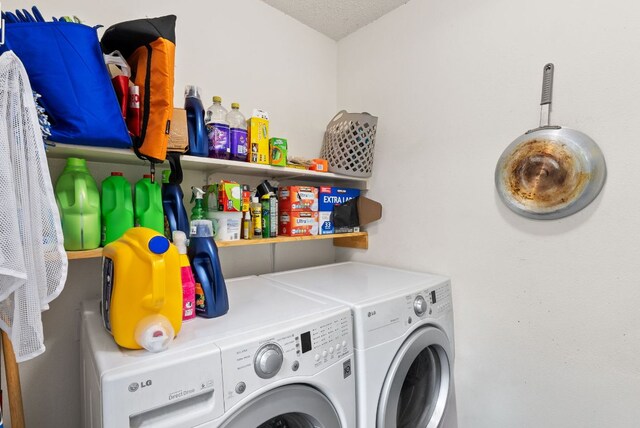 laundry area featuring laundry area and washer and clothes dryer