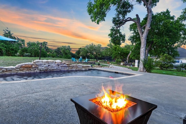 224 Highland Oaks, Leander, TX 78641 - view of patio / terrace with a fire pit