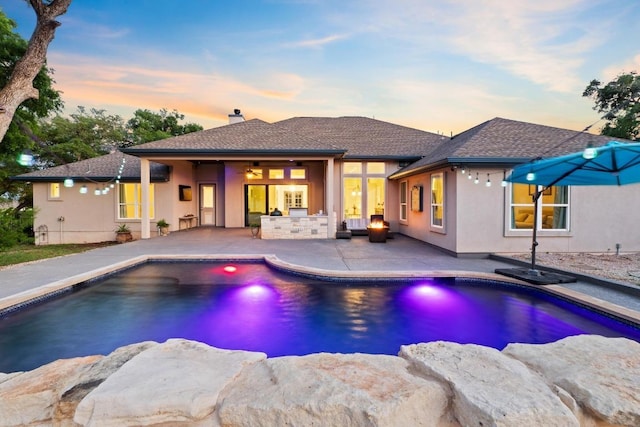 224 Highland Oaks, Leander, TX 78641 - pool at dusk with a patio area, an outdoor pool, and a ceiling fan