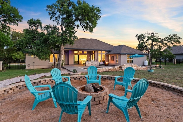224 Highland Oaks, Leander, TX 78641 - back of house featuring a fire pit and a patio
