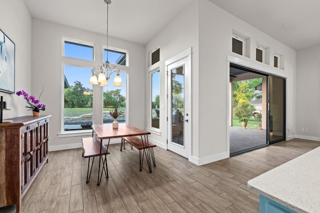 224 Highland Oaks, Leander, TX 78641 - dining space with a chandelier, healthy amount of natural light, and light wood-style floors