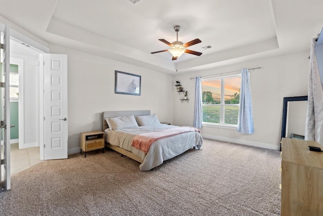 224 Highland Oaks, Leander, TX 78641 - carpeted bedroom with a raised ceiling and a ceiling fan