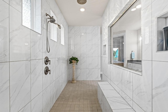 224 Highland Oaks, Leander, TX 78641 - bathroom featuring plenty of natural light and tiled shower