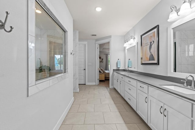 224 Highland Oaks, Leander, TX 78641 - full bath featuring double vanity, tiled shower, tile patterned flooring, ensuite bathroom, and recessed lighting