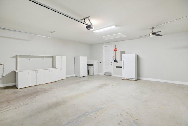 garage with baseboards, a garage door opener, a ceiling fan, and freestanding refrigerator