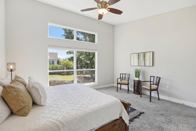 bedroom featuring carpet floors and baseboards