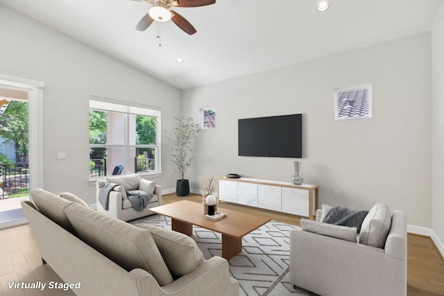 living room featuring a wealth of natural light, recessed lighting, ceiling fan, and vaulted ceiling