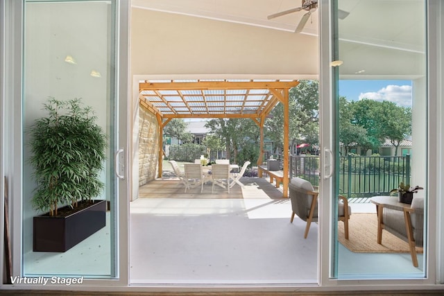entryway with ceiling fan and a sunroom