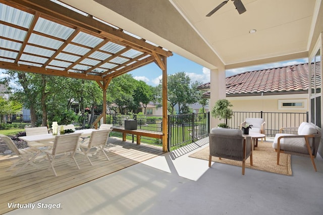 view of patio featuring an outdoor living space, outdoor dining area, and ceiling fan