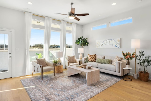 17508 Emperador Dr Unit 65, Pflugerville, TX 78664 - living room with a ceiling fan, wood finished floors, and recessed lighting