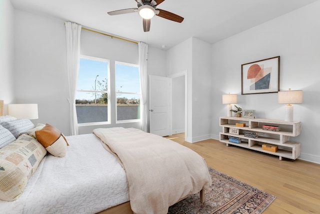 17508 Emperador Dr Unit 65, Pflugerville, TX 78664 - bedroom featuring light wood-type flooring, baseboards, and ceiling fan