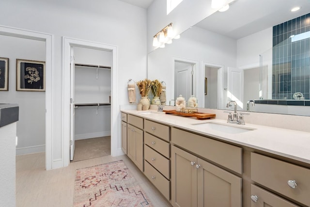 17508 Emperador Dr Unit 65, Pflugerville, TX 78664 - bathroom with double vanity, baseboards, and a spacious closet