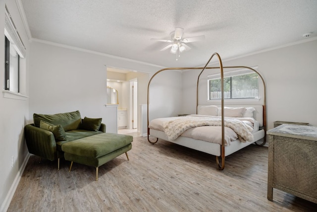 402 San Gabriel Blvd, Georgetown, TX 78628 - bedroom featuring light wood-style flooring, ornamental molding, baseboards, a textured ceiling, and ceiling fan