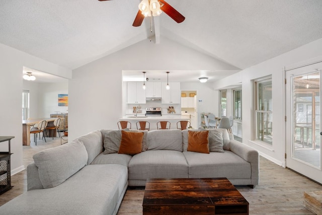 402 San Gabriel Blvd, Georgetown, TX 78628 - living area featuring ceiling fan, light wood-style floors, and baseboards