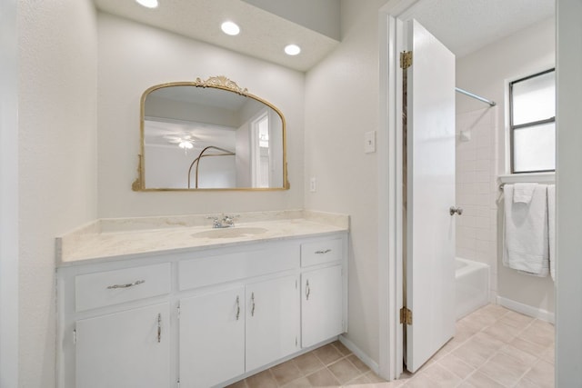 402 San Gabriel Blvd, Georgetown, TX 78628 - bathroom featuring vanity, bathing tub / shower combination, baseboards, recessed lighting, and tile patterned floors