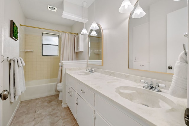 402 San Gabriel Blvd, Georgetown, TX 78628 - bathroom featuring double vanity, shower / tub combo with curtain, toilet, tile patterned floors, and baseboards