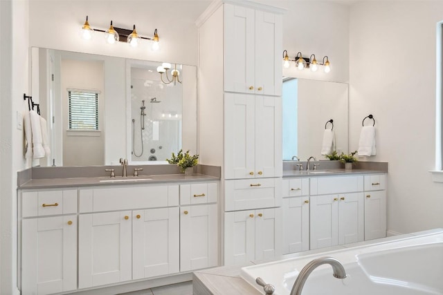 full bath with two vanities, a bath, a stall shower, and a sink