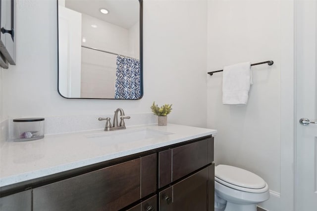 bathroom with vanity, toilet, and a shower with curtain