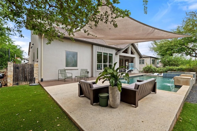 rear view of house featuring a patio, an in ground hot tub, an outdoor pool, a shingled roof, and stucco siding