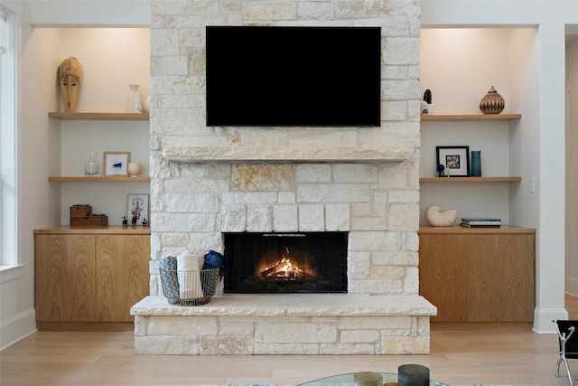 710 Crestone Stream Dr, Austin, TX 78738 - detailed view of a stone fireplace and wood finished floors