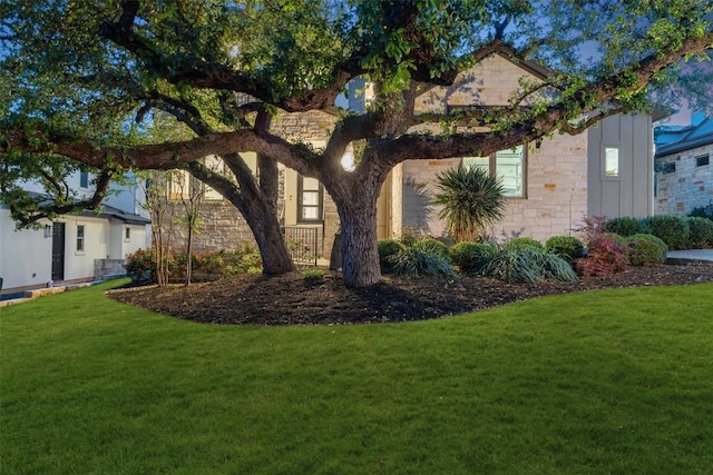 710 Crestone Stream Dr, Austin, TX 78738 - view of property hidden behind natural elements featuring stone siding and a front lawn