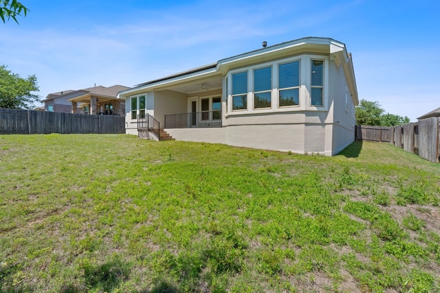 200 S Sage Holw, Dripping Springs, TX 78620 - back of house featuring ceiling fan, a fenced backyard, a yard, and stucco siding