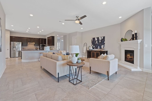 200 S Sage Holw, Dripping Springs, TX 78620 - living room with baseboards, a glass covered fireplace, recessed lighting, and ceiling fan