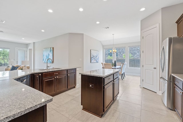 200 S Sage Holw, Dripping Springs, TX 78620 - kitchen featuring stainless steel appliances, healthy amount of natural light, a kitchen island, light tile patterned floors, and recessed lighting