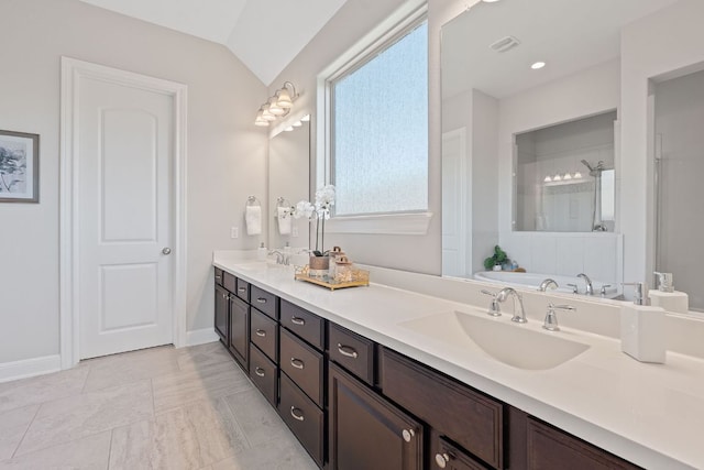 200 S Sage Holw, Dripping Springs, TX 78620 - bathroom featuring visible vents, a sink, double vanity, and tiled shower