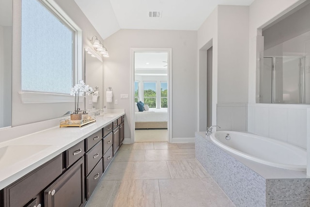 200 S Sage Holw, Dripping Springs, TX 78620 - full bathroom with double vanity, a bath, a stall shower, and lofted ceiling