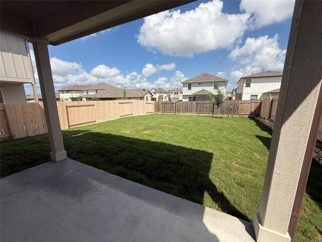 577 Backstays Loop, Kyle, TX 78640 - fenced backyard featuring a patio and a residential view