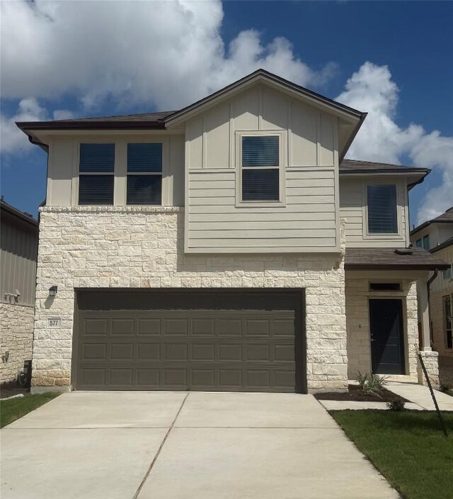 577 Backstays Loop, Kyle, TX 78640 - view of front of home featuring stone siding, a garage, and driveway