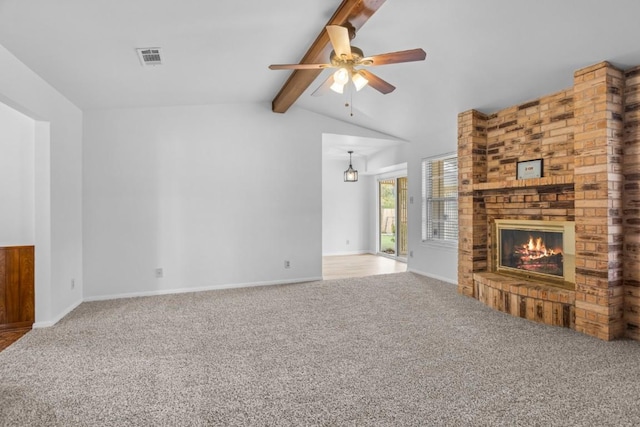 unfurnished living room featuring vaulted ceiling with beams, baseboards, a fireplace, carpet flooring, and ceiling fan