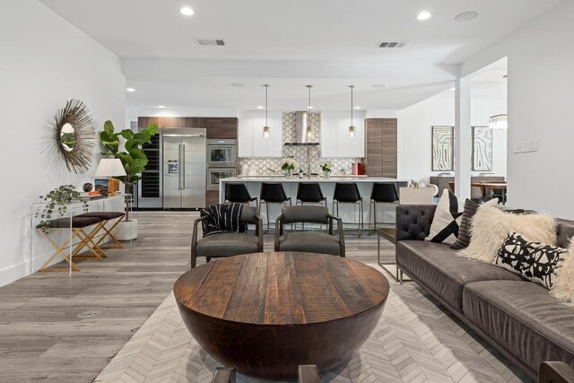 6103 Twin Ledge Dr, Austin, TX 78731 - living area with recessed lighting, light wood-style flooring, and a chandelier