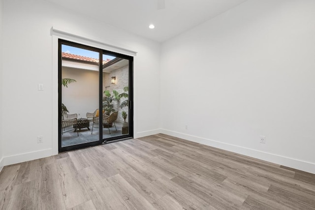6103 Twin Ledge Dr, Austin, TX 78731 - spare room with wood finished floors and recessed lighting
