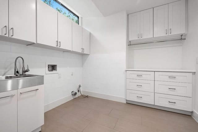 6103 Twin Ledge Dr, Austin, TX 78731 - laundry room featuring cabinet space and washer hookup
