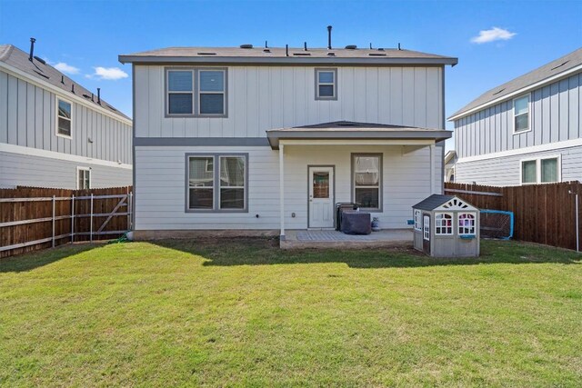 145 Fiery Skipper Ln, Georgetown, TX 78626 - back of property featuring board and batten siding and a patio area